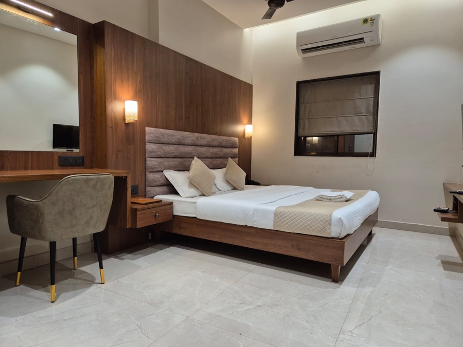 A Premium room with a wood feature wall, desk and window